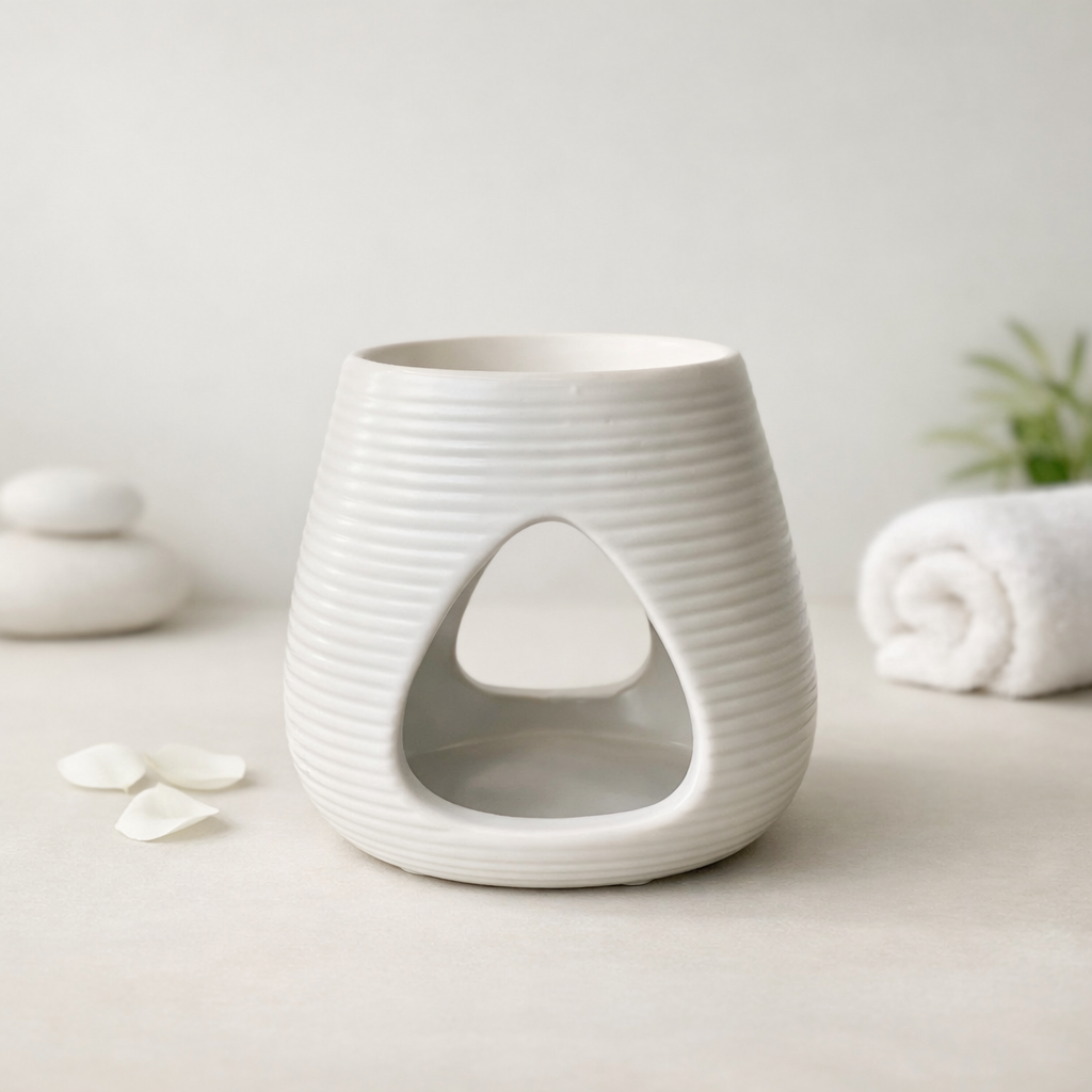 White ceramic wax melt burner with texture on a white surface